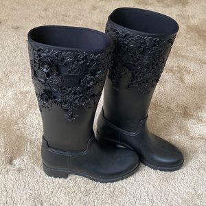 Knee high rain boots by Melissa with 3D rose design